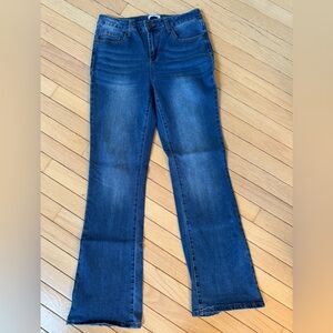 Bleu boot cut blue jeans with flap button back pockets. Size 8. EUC